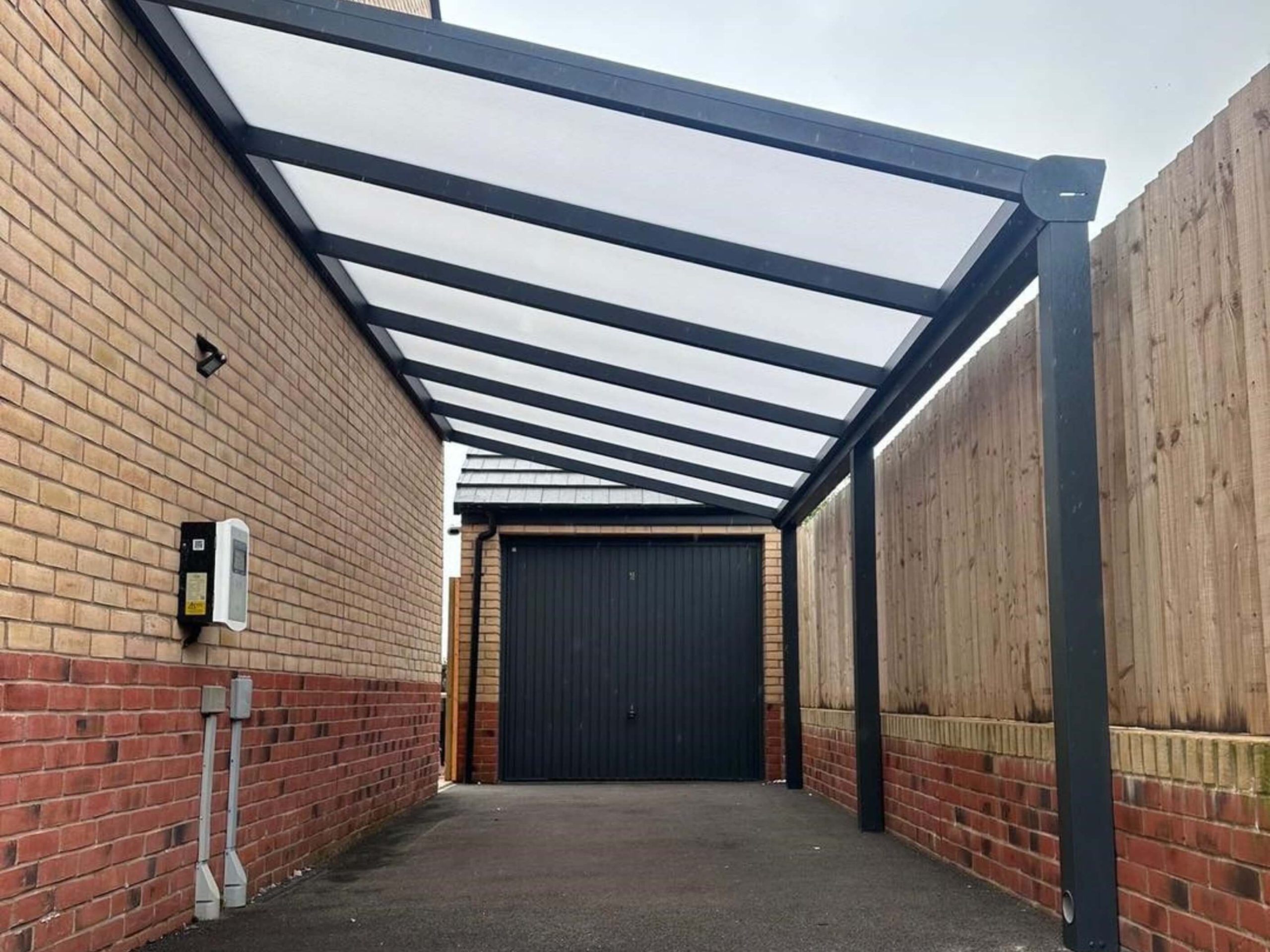 Anthracite grey carport with polycarbonate roof