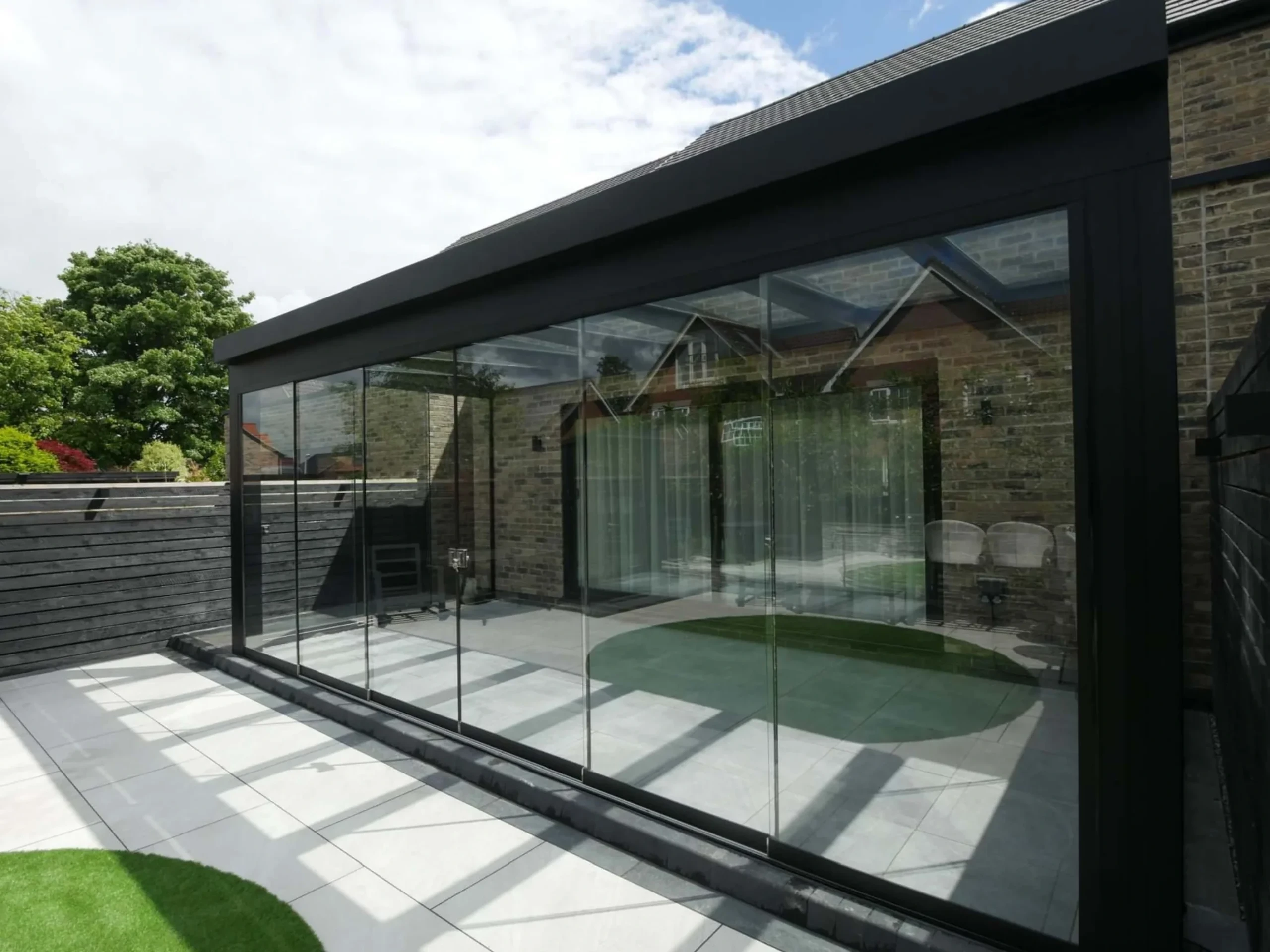 Jet black aluminium frame glass room veranda with lockable glass sliding doors