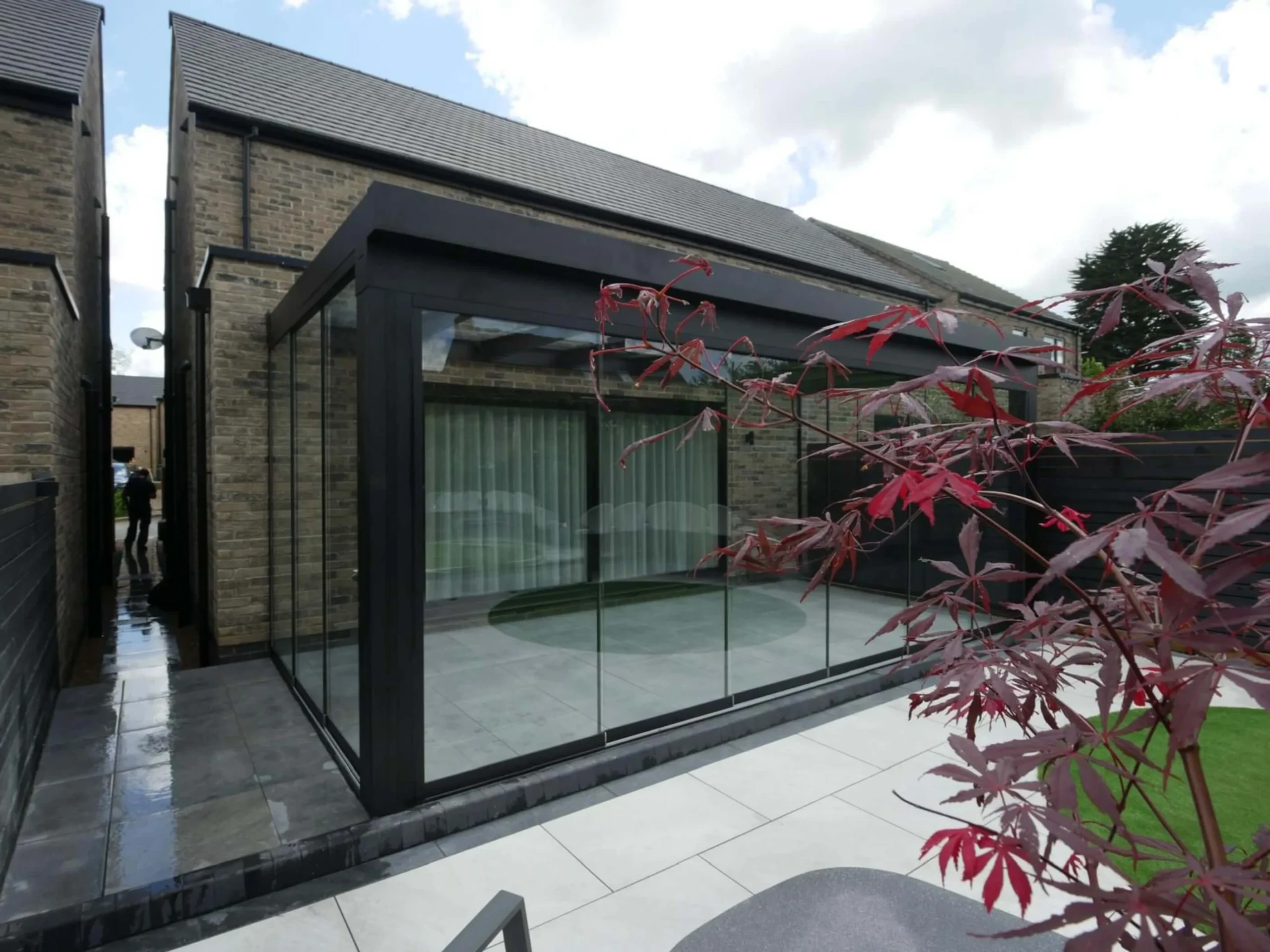Jet black aluminium frame glass room veranda with lockable glass sliding doors